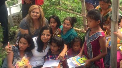 Staff and children of the orphanage huddle after the earthquake