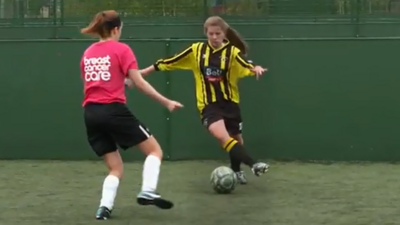 Two Girls Playing Football