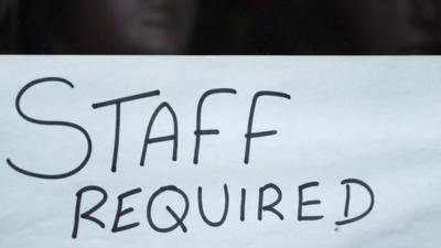 Staff required sign in a Hounslow shop window