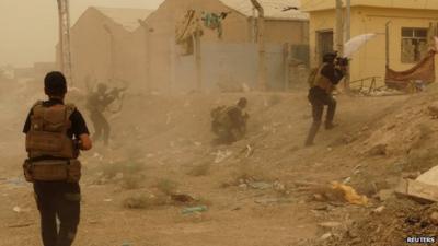 Iraqi security forces defending their headquarters