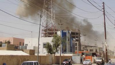 Smoke rising after bomb attack in Ramadi, 15 May 2015