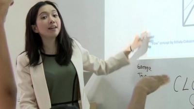 Michelle Sun teaching Hong Kong children computer coding skills