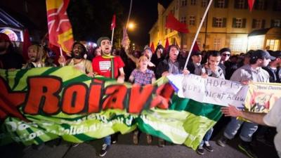 Protesters march peacefully against the upcoming G7 summit