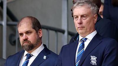 Jeremy Dale (right) stands in the executive box at Wembley Stadium