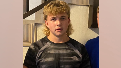 Sidney Brook, who has a blonde mullet haircut and brown eyes.