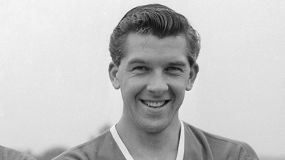 Black-and-white photograph from 11 August 1959 of Manchester United star Ronnie Cope. Wearing his club shirt, Cope, with swept-back dark hair, grins for the camera.