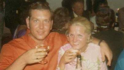 Alan and Ann Shawyer in their twenties having a glass of champagne 
