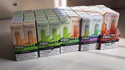 A row of five colourful boxes of vapes that read Pro Max