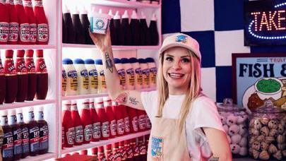 Lucy Sparrow in her hand-stitched felt chip shop 