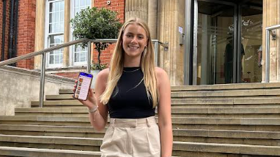 Natasha Dawson shows the Careology app on her phone outside the Royal Marsden Hospital