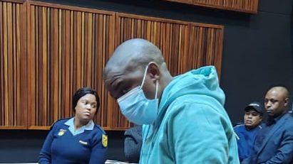 Nkosinathi Phakathi wearing a face mask and blue tracksuit during his sentencing at the Johannesburg High Court