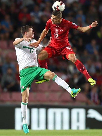 Northern Ireland's Paddy McNair is beaten to the ball by the Czech Republic's David Pavelka