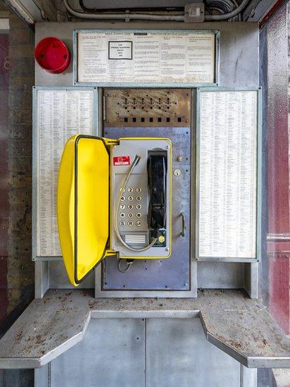 Inside, a working phone can be found with an old directory