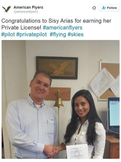 Sisy Arias shakes hand with an America Flyers employee