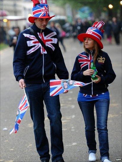 Royal supporters walk along The Mall in London on the day of the royal wedding of Prince William and Kate Middleton