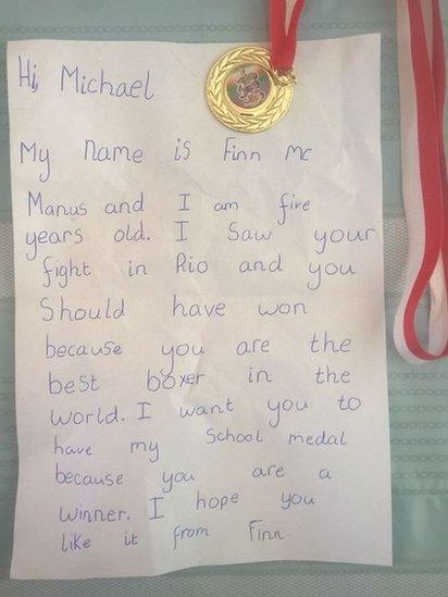 Meadhbh's photo of Finn McManus' medal and letter to Michael Conlan