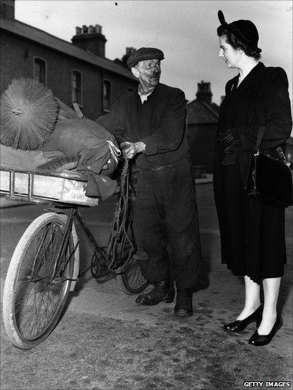 Margaret Thatcher, then known as Margaret Roberts, talks to a chimney sweep while canvassing for votes in Dartford during the 1951 General Election