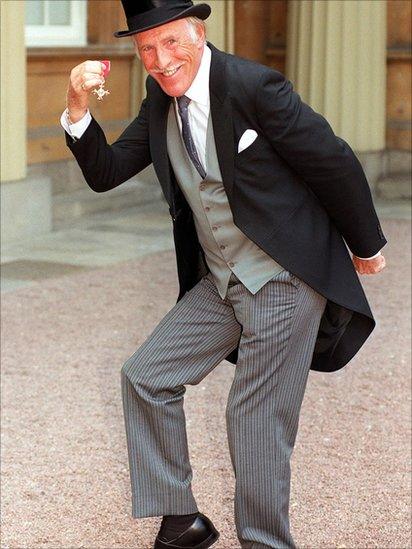 Bruce Forsyth collecting his OBE