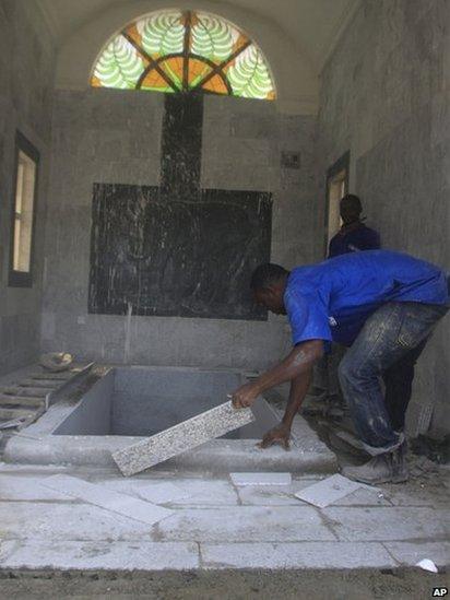 Workers prepare a mausoleum for Chukwuemeka Ojukwu