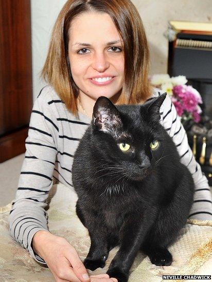 Woman and her black cat