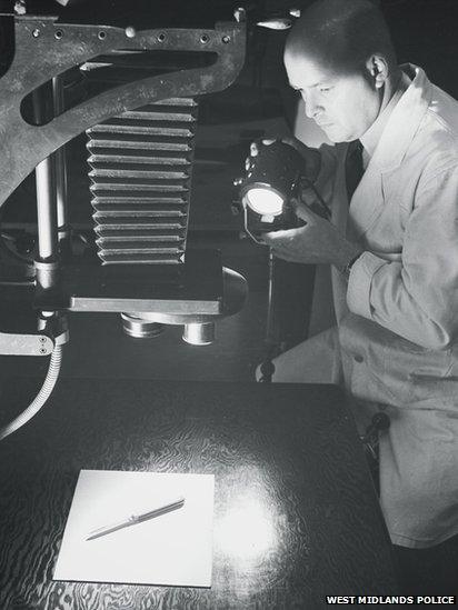 A forensic investigator at work in the 1950s or 1960s