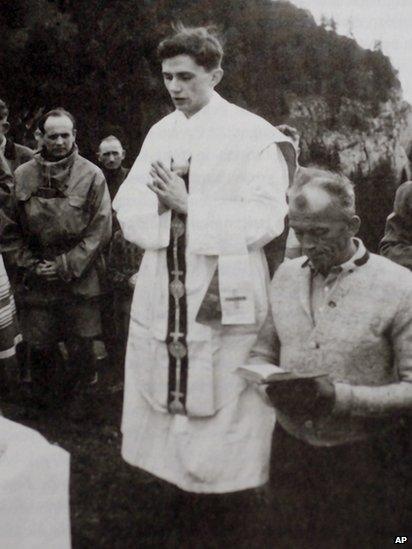 Joseph Ratzinger leads an outdoor mass in Switzerland in the summer of 1952