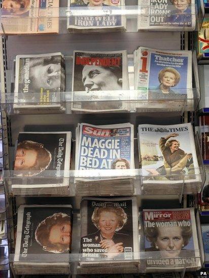 A view of the front pages of national newspapers on a news stand in central London, the day after Baroness Thatcher died at the age of 87.