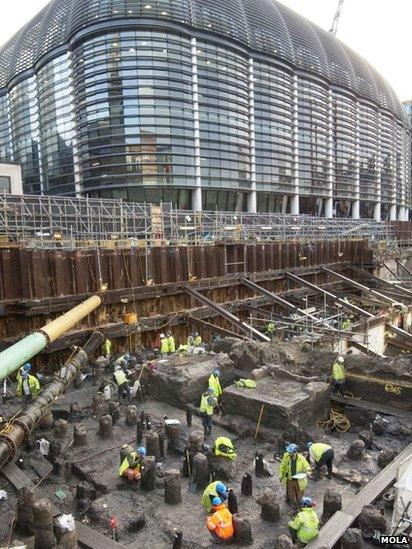 The excavation site next to a modern London building