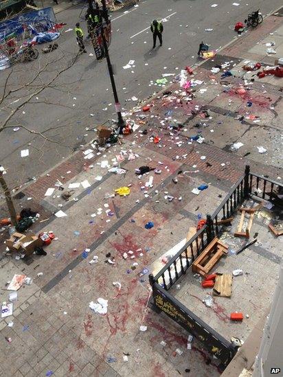 Blood on the streets at the scene of one of the explosions at the Boston marathon, 15 April 2013