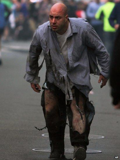 A man walks away with minor injuries from the Boston marathon bombings, 15 April 2013