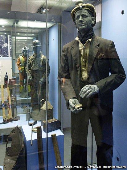 A display case at the Pitheads Baths at Big Pit showing miners' dress and tools