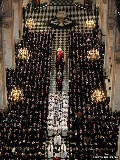 The coffin bearing the body of Baroness Thatcher is carried into St Paul's Cathedral