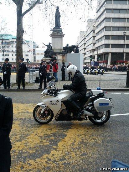 Police rider at the back of the cortege. Photo: Hayley Chalmers