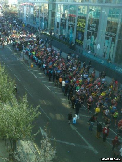 Runners run along one side of the road in Deptford, just after mile 7. Photo: Adam Brown