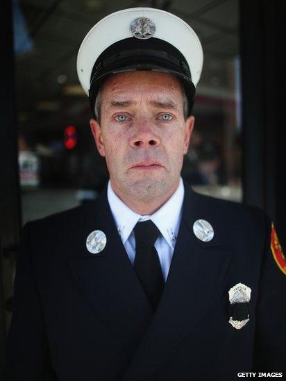 Medford Fire Department Captain Tom Brennan poses after attending the funeral of Krystle Campbell, 22 April