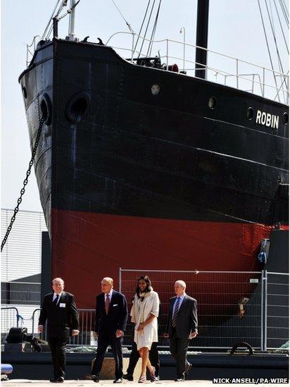 The Duke of Edinburgh, (second left) during a visit to inaugurate the SS Robin's new permanent home in Royal Victoria Dock, east London