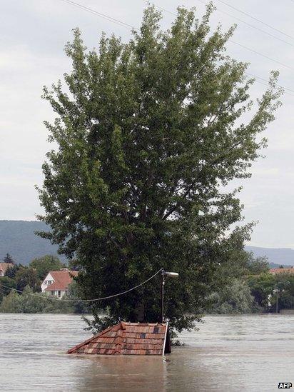 The roof of a submerged house in Kisoroszi, north of Budapest, Hungary, 7 June, 2013.