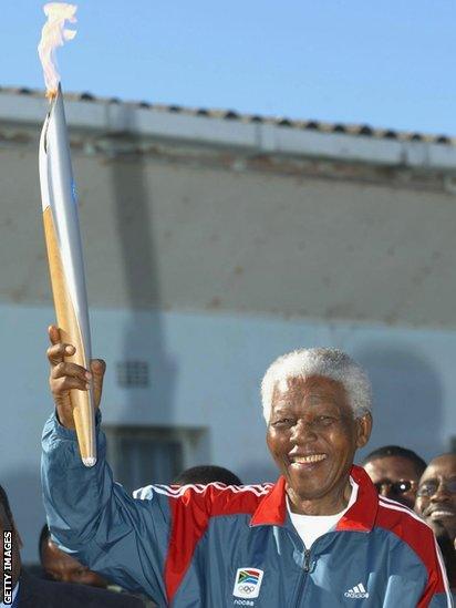 Nelson Mandela with Olympic torch