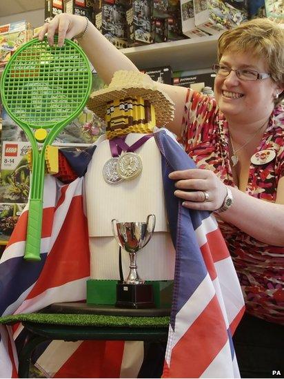 Dunblane's Helen Gourley geared up for the a historic match with a Lego Andy Murray at a toy shop in the tennis star's home town.