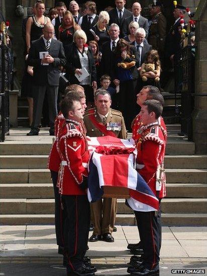 The family of Fusilier Lee Rigby follow his coffin as it leaves Bury Parish Church after his military funeral