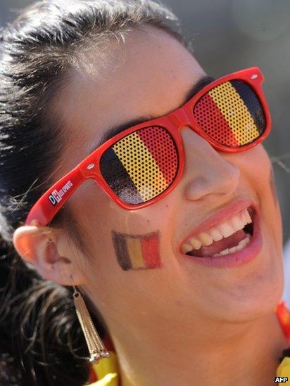 Well-wisher adorned in the colours of the Belgian flag on Belgian national day on 21 July 2013