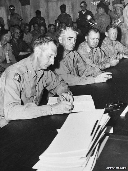 American Lieutenant General Mark Clark (1896 - 1984) signing the Korean Armistice at Munsan, South Korea, 27 July 1953