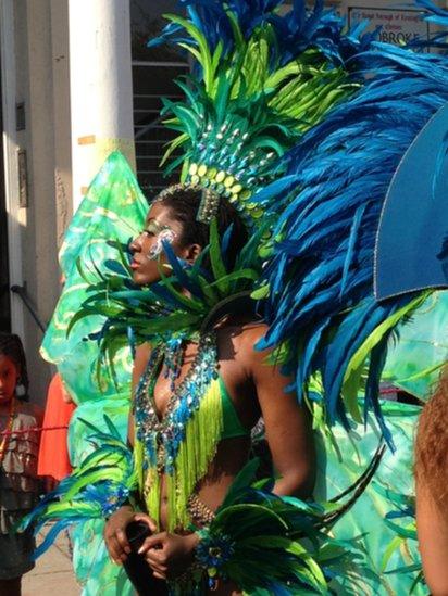 Dancers in colourful costumes waiting to perform. Photo: Caroline Holmes.