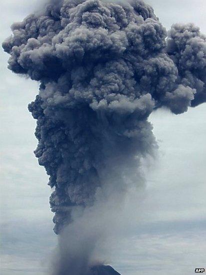 A giant column of ash clouds rise from the crater of the Mount Sinabung volcano during a fresh eruption on 17 September, 2013, as seen from Karo district.