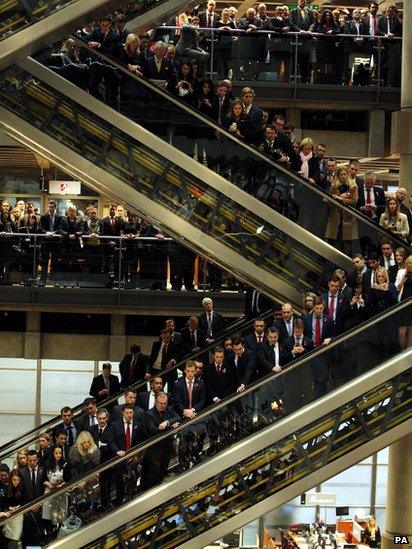 Lloyds of London hold a service for Remembrance Day with a ceremonial piper and a wreath laying ceremony, in the City, London