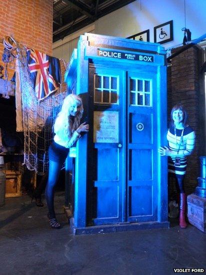 Two people posing with the Tardis. Photo: Violet Ford