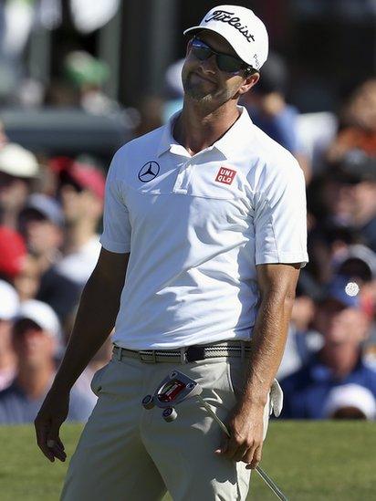 Adam Scott reacts with disappointment after missing a crucial putt on the 18th green and giving Rory McIlroy the chance to secure a one-shot victory in Sydney