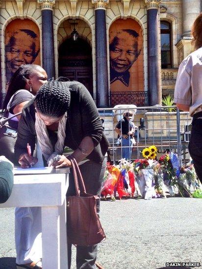 Signing a book of remembrance. Photo: Dakin Parker