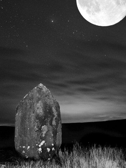 Maen Llia standing stone by moonlight near Ystradfellte, taken by Geoff Moss from Troedyrhiw whilst out walking with his faithful companion