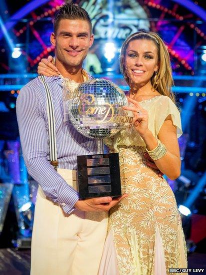 Abbey Clancy and partner Aljaz Skorjanec with their Strictly trophy